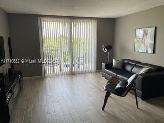 living room with light hardwood / wood-style floors