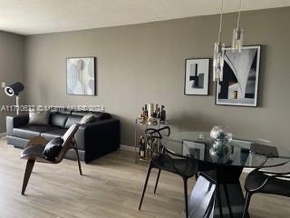 dining space featuring light hardwood / wood-style floors