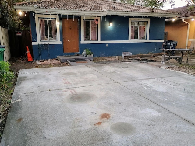 view of front facade with a patio area