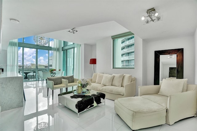 living room with expansive windows and light tile patterned flooring