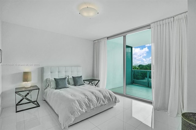 tiled bedroom with expansive windows and access to outside