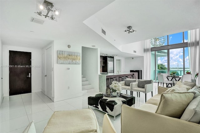 living room with sink and light tile patterned flooring