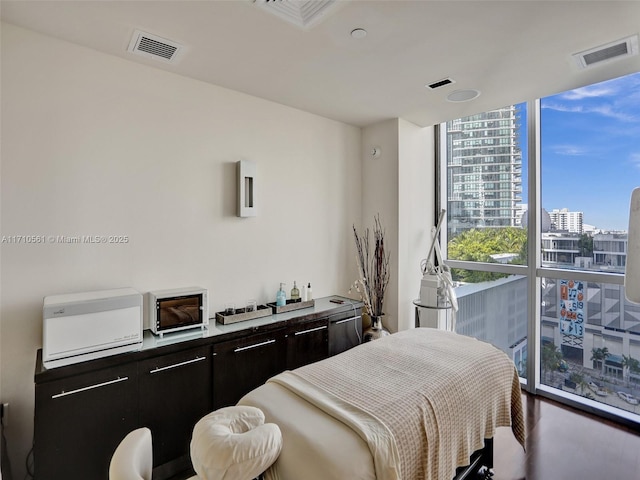 bedroom with floor to ceiling windows