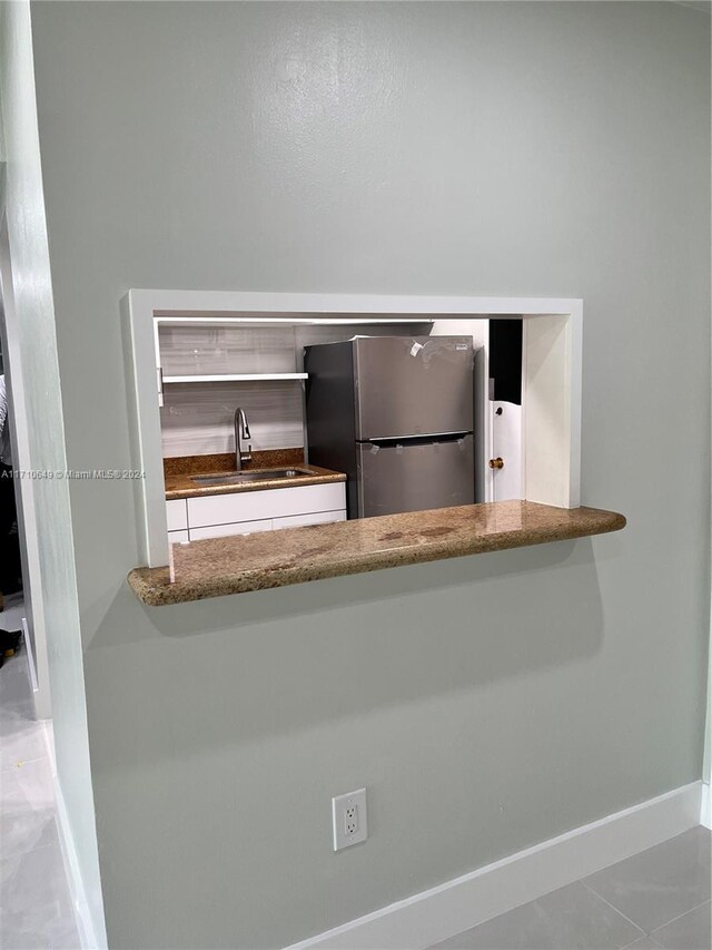 details with stainless steel refrigerator and sink