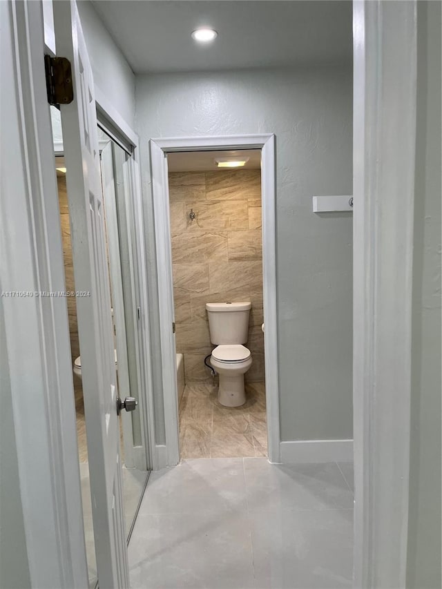 bathroom featuring tile patterned floors and toilet