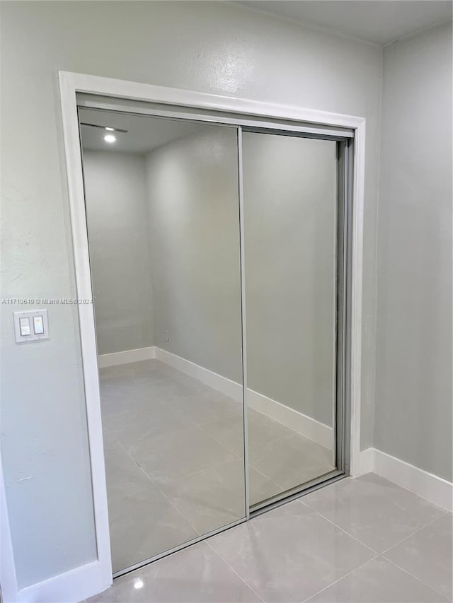 bathroom with tile patterned floors