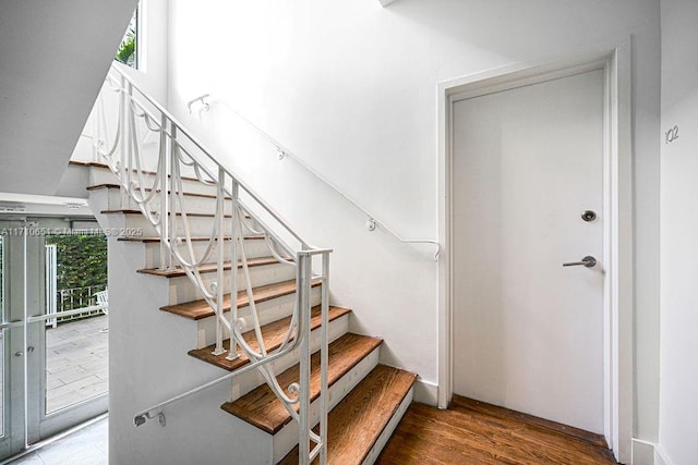 stairway featuring hardwood / wood-style flooring