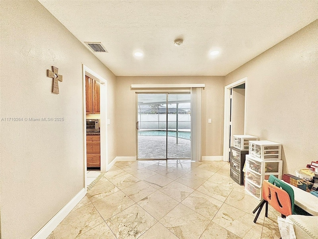 interior space featuring a textured ceiling