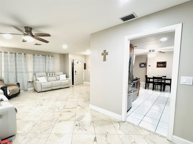 living room featuring ceiling fan