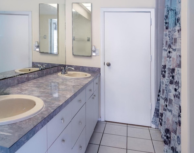 bathroom featuring tile patterned flooring and vanity