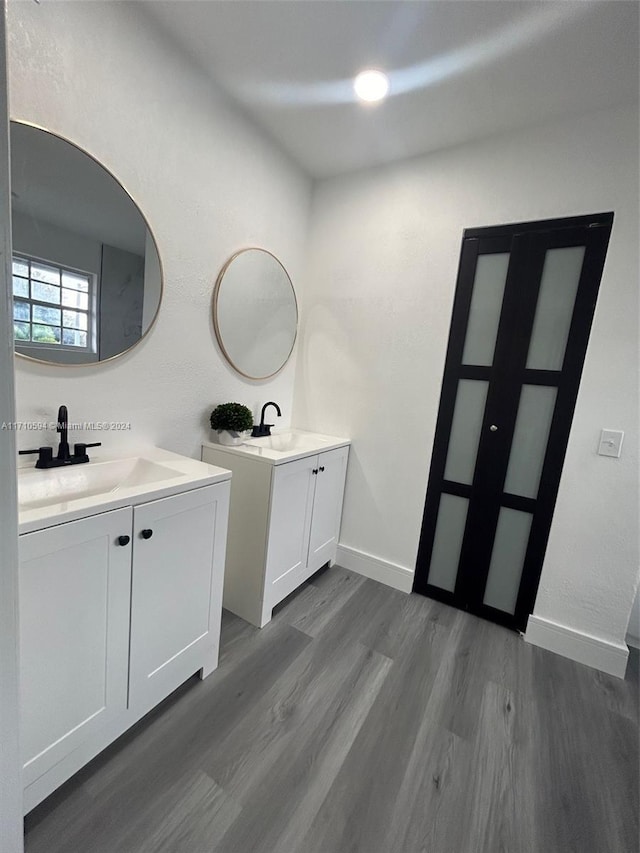 bathroom featuring vanity and hardwood / wood-style flooring