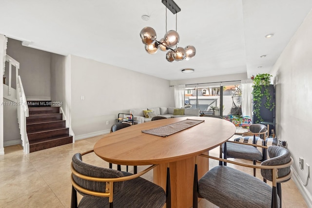 dining space featuring an inviting chandelier