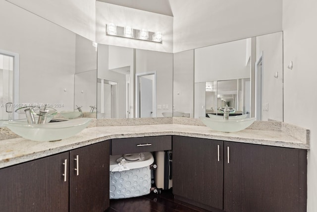 bathroom featuring vanity and wood-type flooring