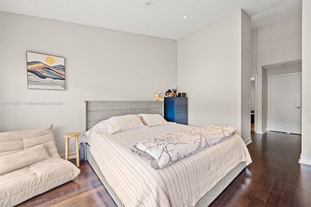 bedroom featuring dark wood-type flooring