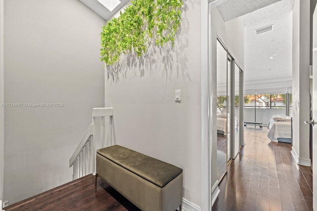 hallway with dark wood-type flooring