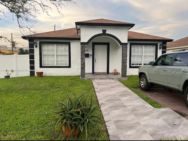 view of front of property with a yard