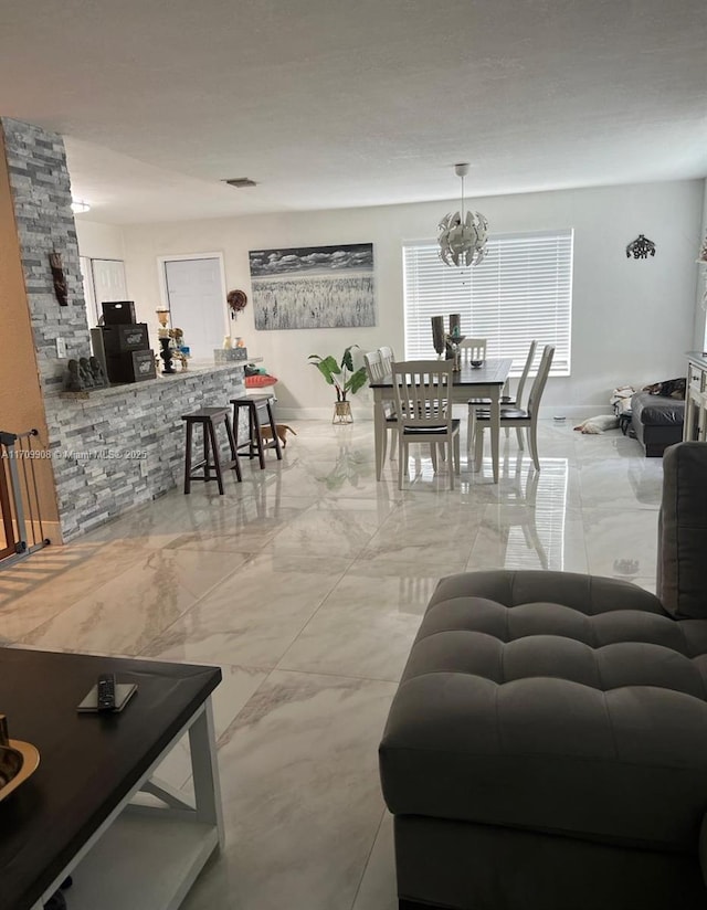 living room featuring a notable chandelier