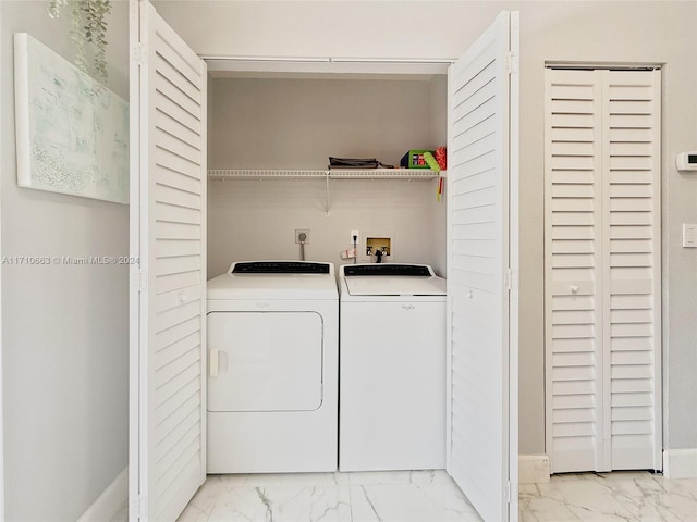 laundry room with washer and dryer