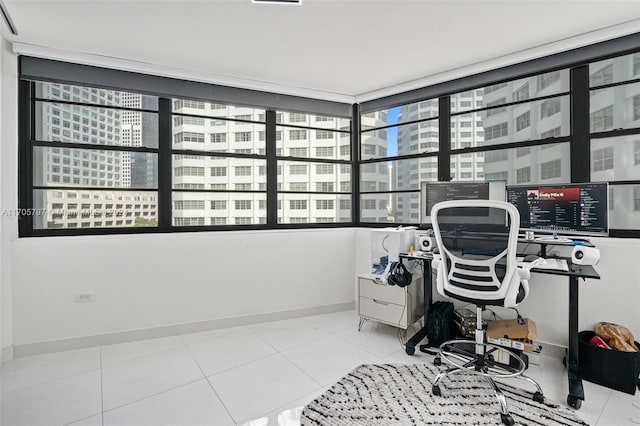 home office with light tile patterned flooring and a healthy amount of sunlight