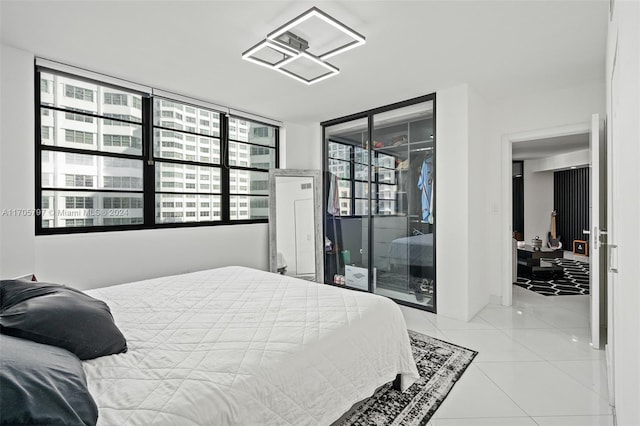 tiled bedroom with expansive windows