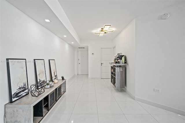 corridor featuring light tile patterned floors