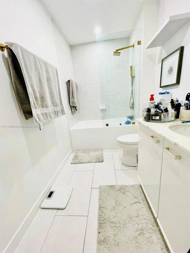 full bathroom featuring toilet, vanity, and tiled shower / bath