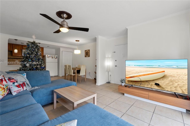 living room with ceiling fan and light tile patterned flooring