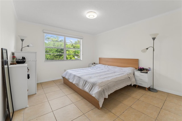 bedroom featuring light tile patterned floors