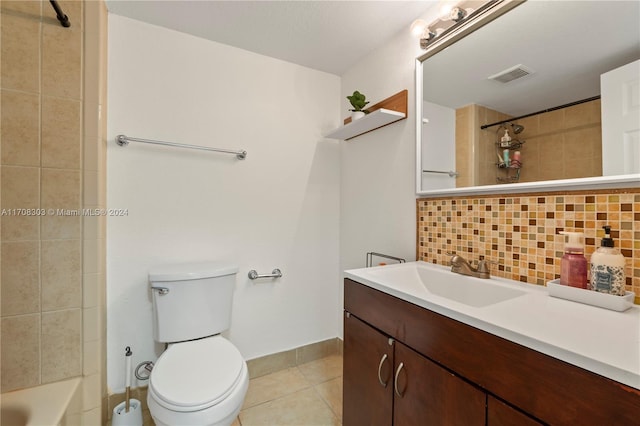 bathroom featuring decorative backsplash, tile patterned flooring, vanity, and toilet