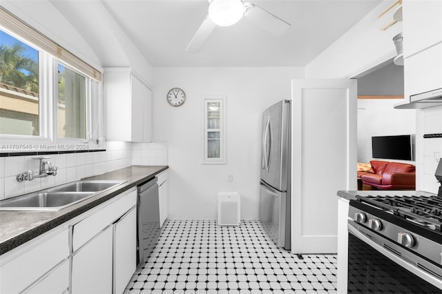 kitchen with appliances with stainless steel finishes, white cabinetry, and sink