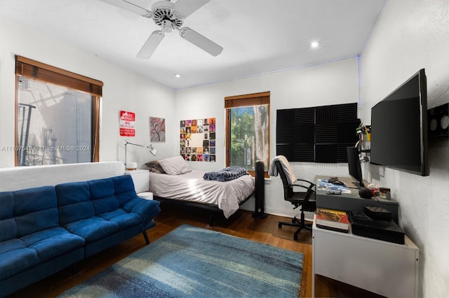 bedroom with ceiling fan and dark hardwood / wood-style floors