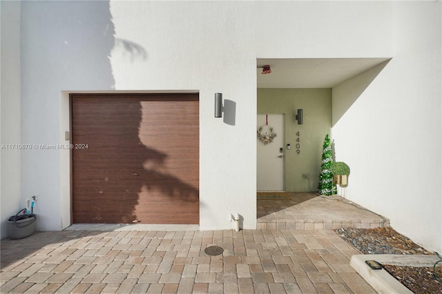 entrance to property featuring a garage