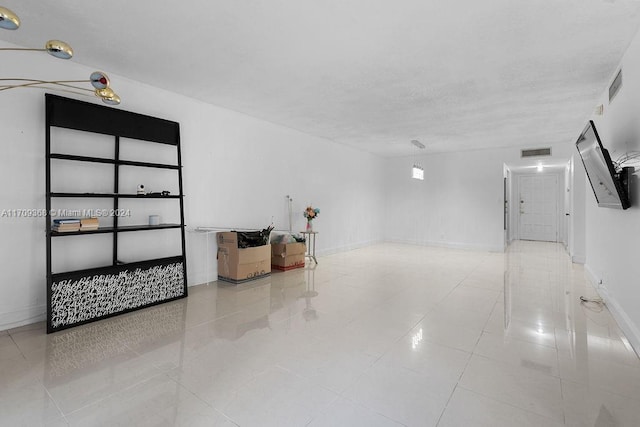 3330 Spanish Moss Ter Unit 109, Lauderhill, FL 33319 - unfurnished room with tile patterned flooring and a textured ceiling