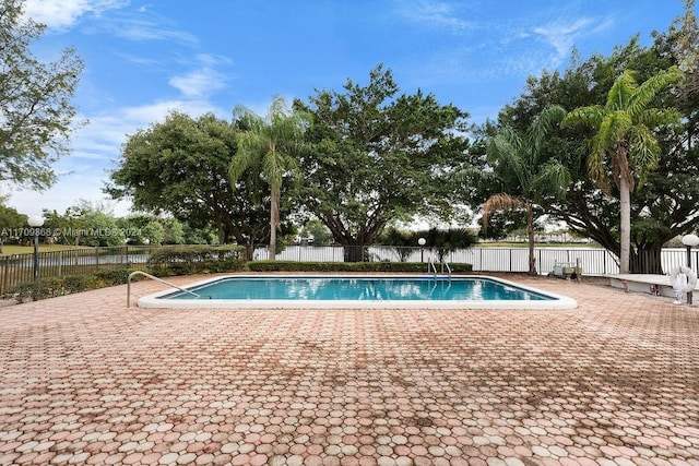 view of swimming pool featuring a patio