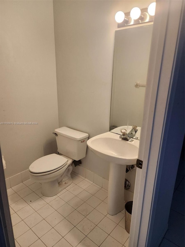 bathroom with tile patterned floors and toilet