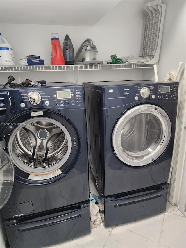 washroom featuring tile patterned floors and separate washer and dryer