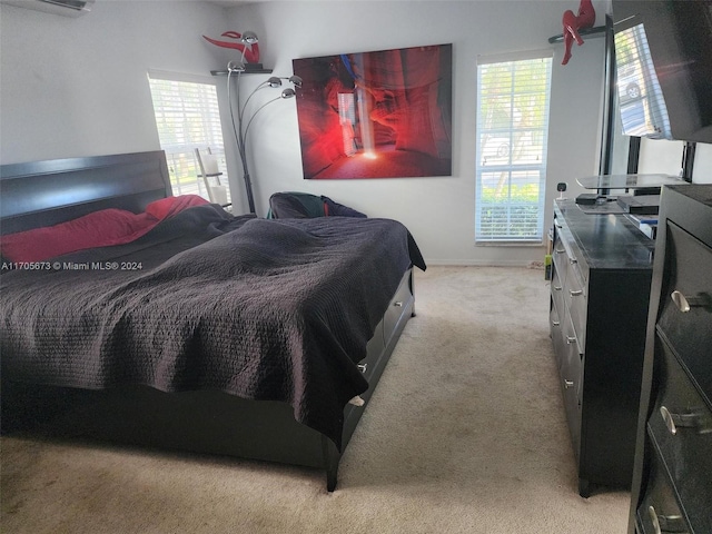 carpeted bedroom with a wall mounted air conditioner and multiple windows