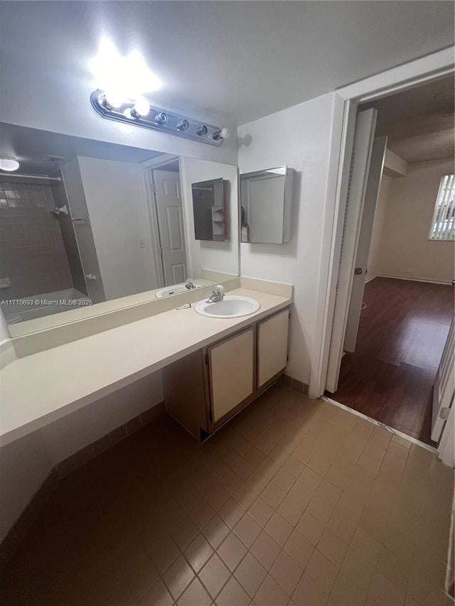 bathroom with tile patterned floors and vanity