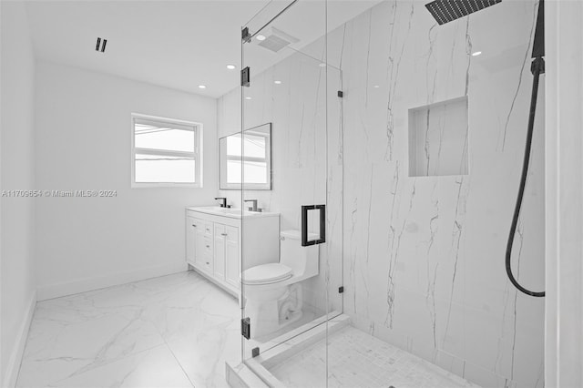 bathroom featuring vanity and an enclosed shower