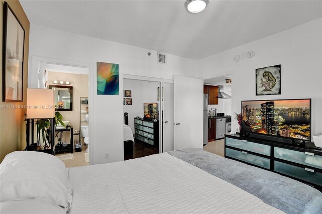 bedroom featuring stainless steel refrigerator