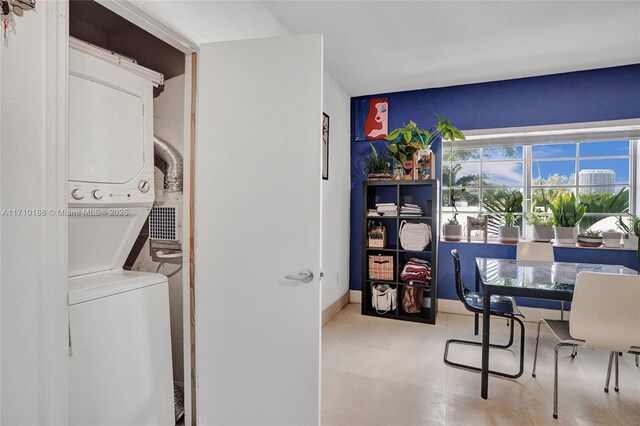 interior space featuring stacked washer and dryer