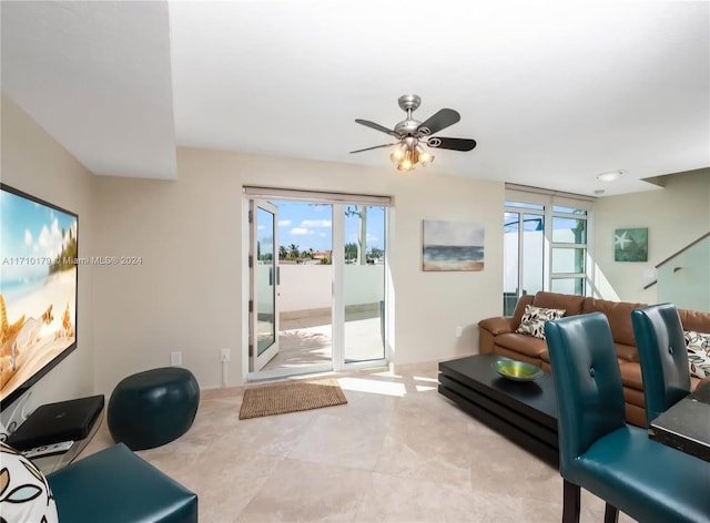 interior space with ceiling fan