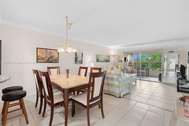 tiled dining space with a chandelier and ornamental molding