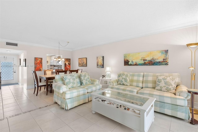 tiled living room with crown molding and an inviting chandelier