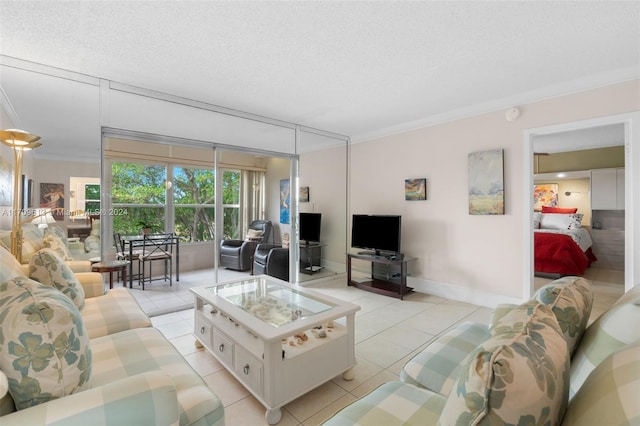 tiled living room featuring a textured ceiling and ornamental molding