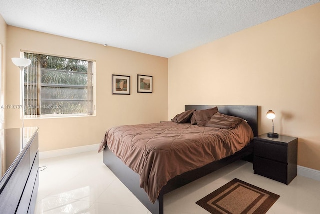 bedroom featuring a textured ceiling