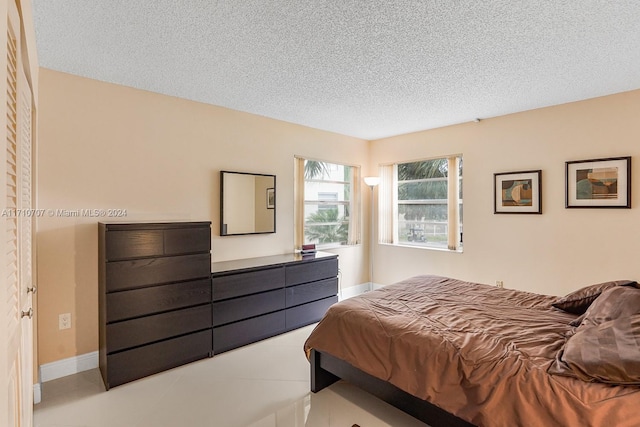 bedroom featuring a textured ceiling