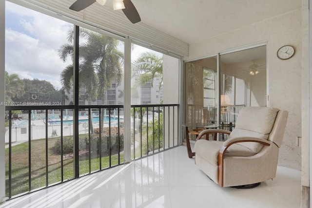 sunroom / solarium with ceiling fan