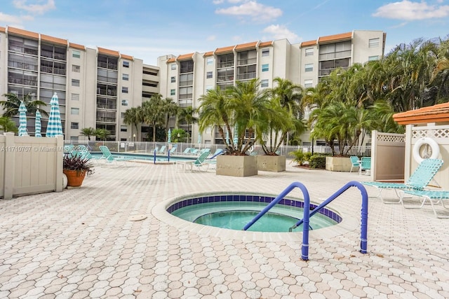 view of pool featuring a hot tub