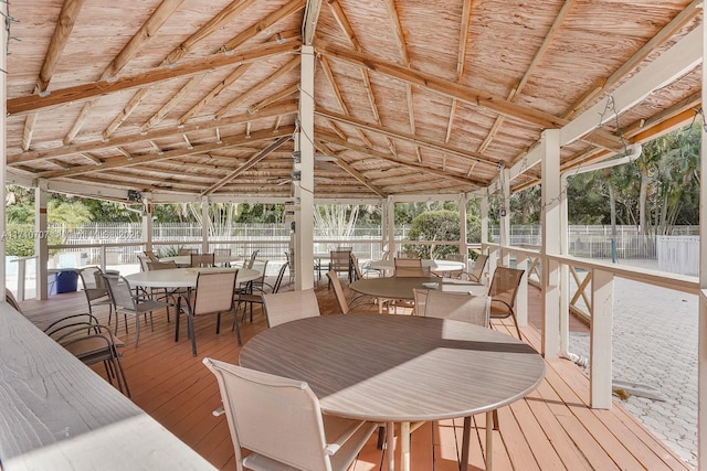 sunroom / solarium featuring a wealth of natural light and wood ceiling